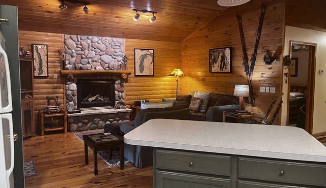 Waterfront log home on Lake Bellaire. Pet friendly. Fireplace, dock. Dog ok in Bellaire